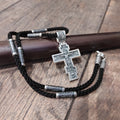 A sterling silver pendant in the shape of an Orthodox crucifix: a religious pendant.